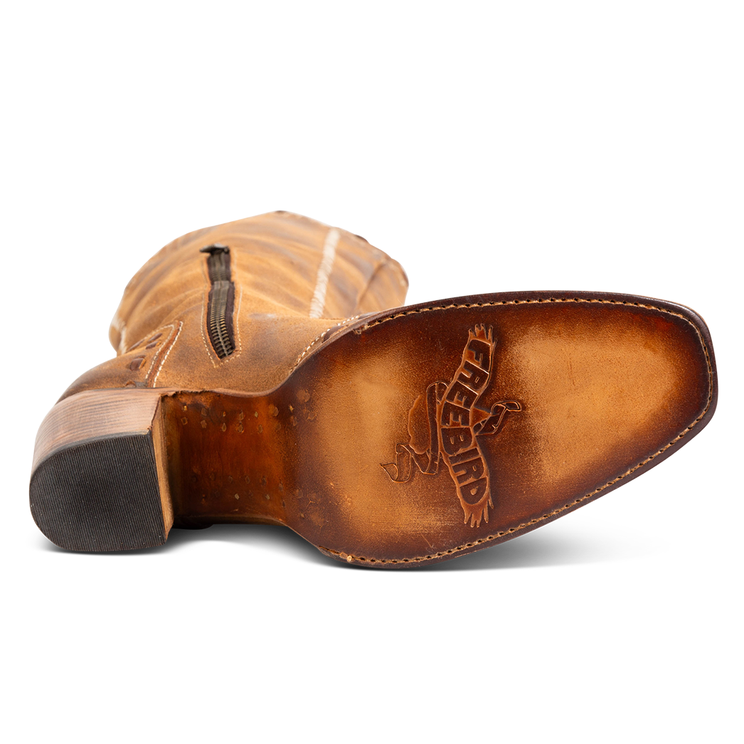 Tan leather sole imprinted with FREEBIRD on women's Paisley cognac suede boot