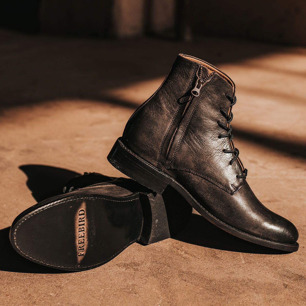 FREEBIRD men's Paxton black featuring an inside zip closure, leather zipper cover and lace up detailing