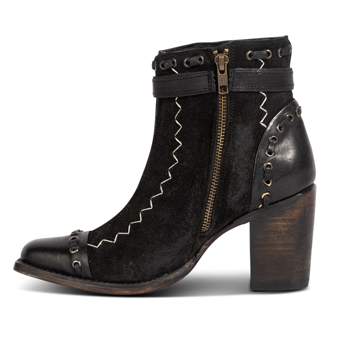 Inside view showing brass zip closure and leather whip stitch detailing on FREEBIRD women's Poppy black suede bootie