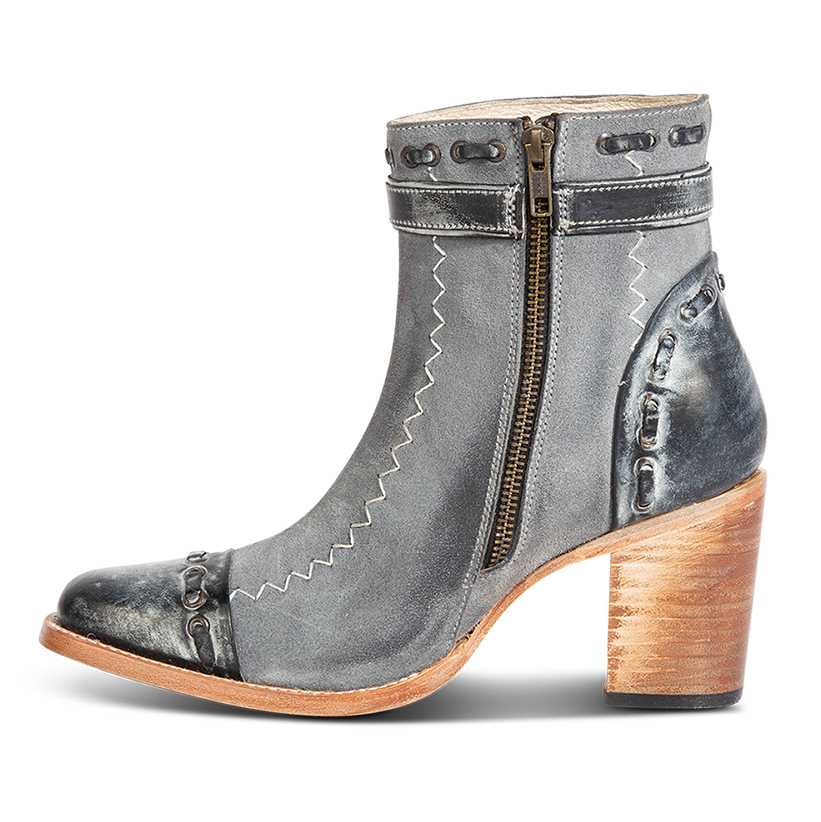 Inside view showing brass zip closure and leather whip stitch detailing on FREEBIRD women's Poppy blue suede bootie