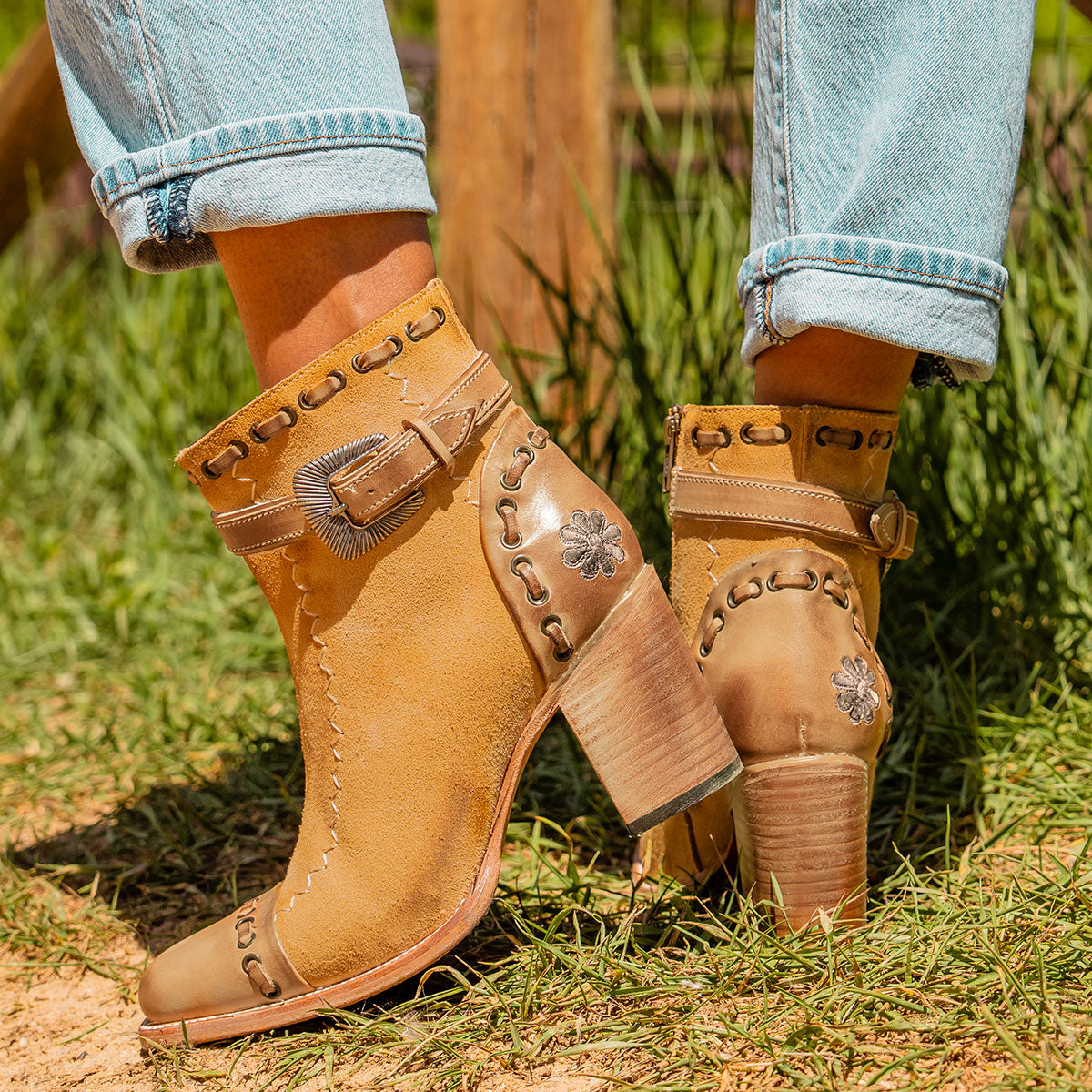 Tan suede POPPY heeled bootie with a stacked block heel, side zip closure, and distressed finish for women.