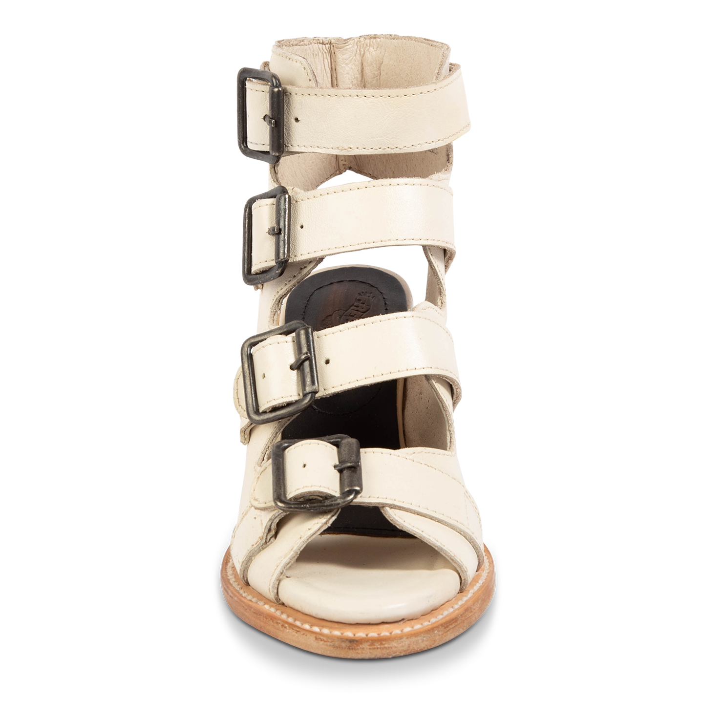Front view showing leather strap detailing and brass working buckles on FREEBIRD women's Quail beige sandal