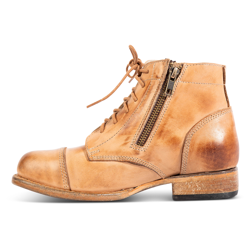 Inside view showing working brass zipper, low heel and round toe on FREEBIRD women's Rafter beige leather bootie