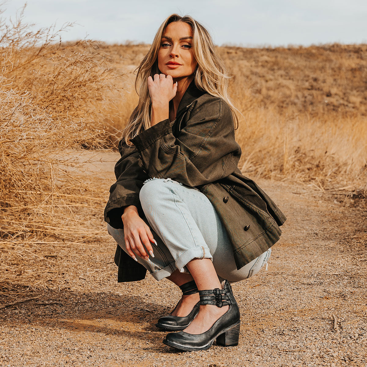 FREEBIRD women's Randi black leather open construction ankle strap heel with adjustable rustic buckles lifestyle image