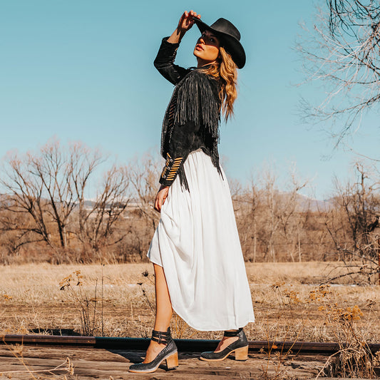 FREEBIRD women's Randi black snake embossed leather open construction ankle strap heel with adjustable rustic buckles lifestyle image