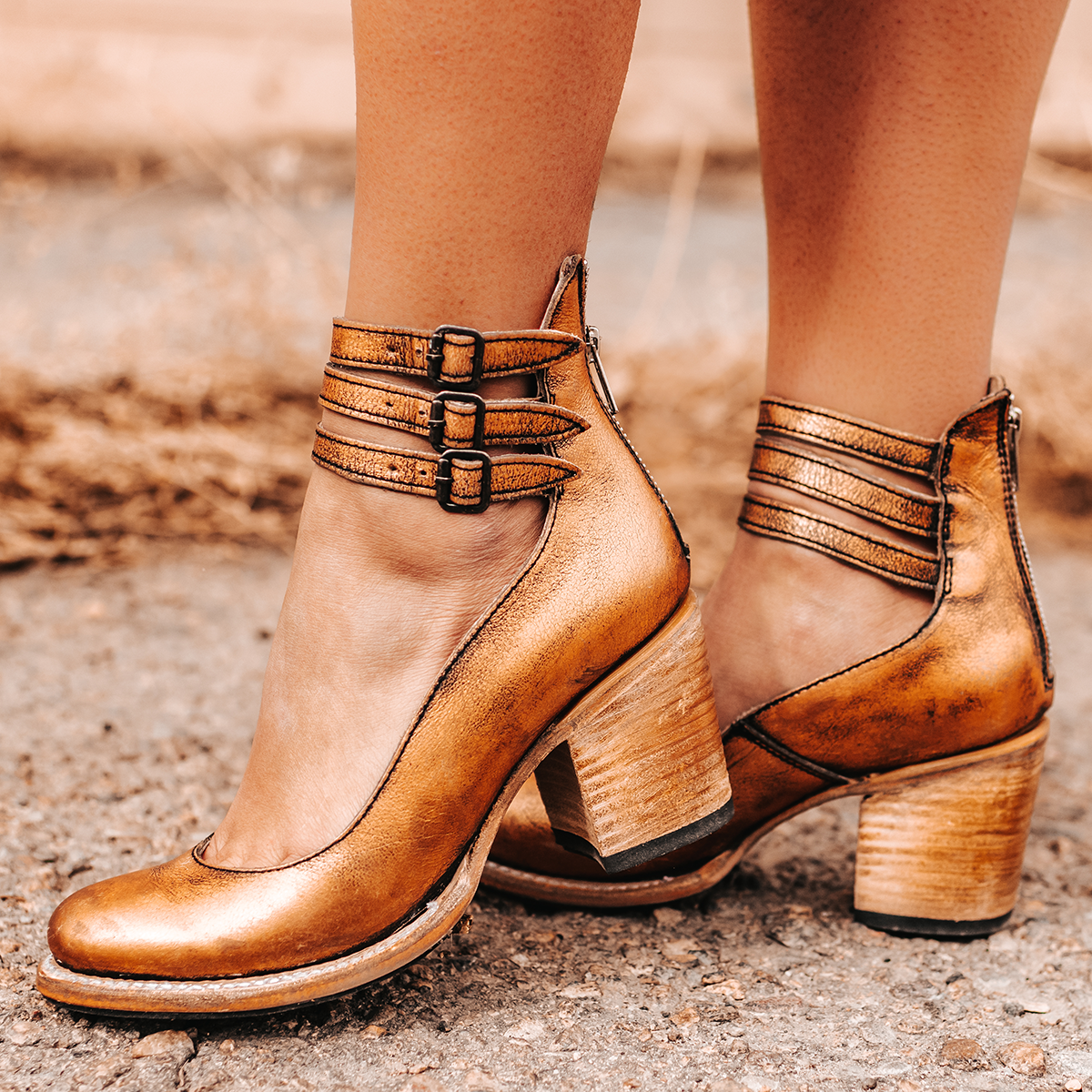 FREEBIRD women's Randi bronze open construction ankle strap heel with adjustable rustic buckles