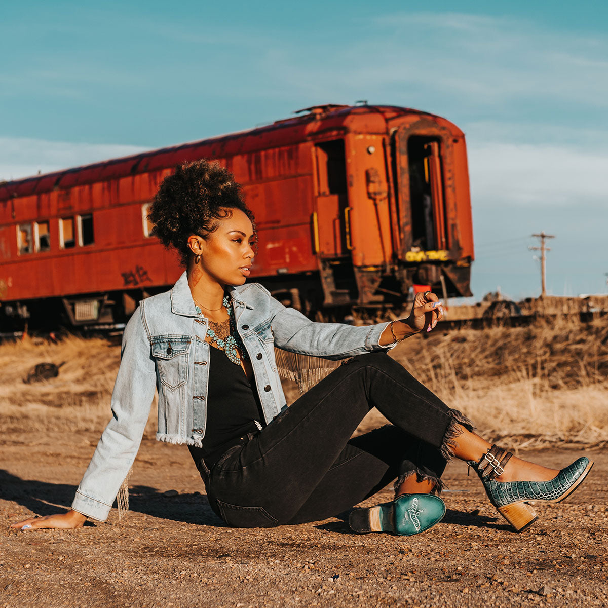 FREEBIRD women's Randi turquoise croco embossed leather open construction ankle strap heel with adjustable rustic buckles lifestyle image