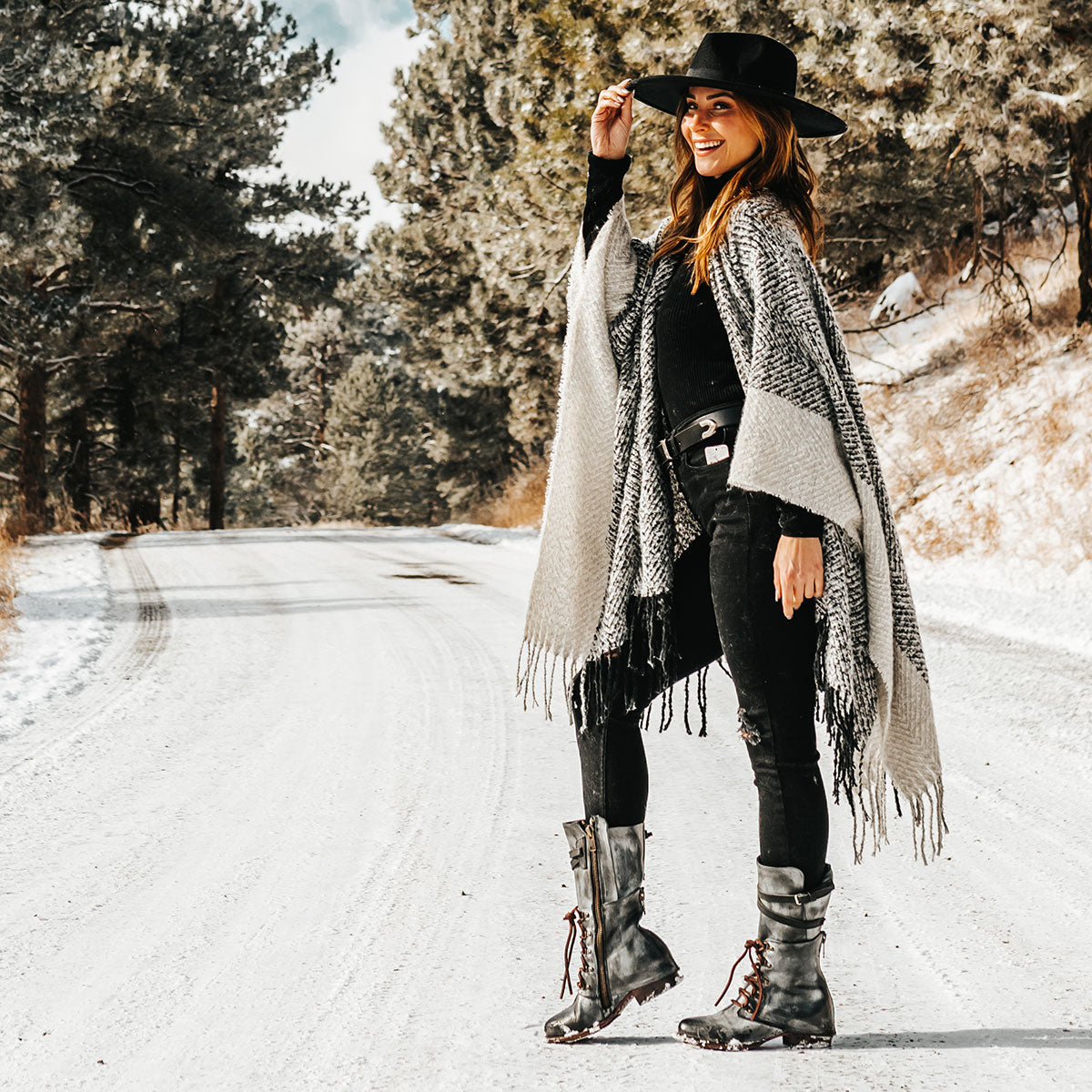 FREEBIRD women's Ravi black front lacing inner zip closure mid calf boot lifestyle image