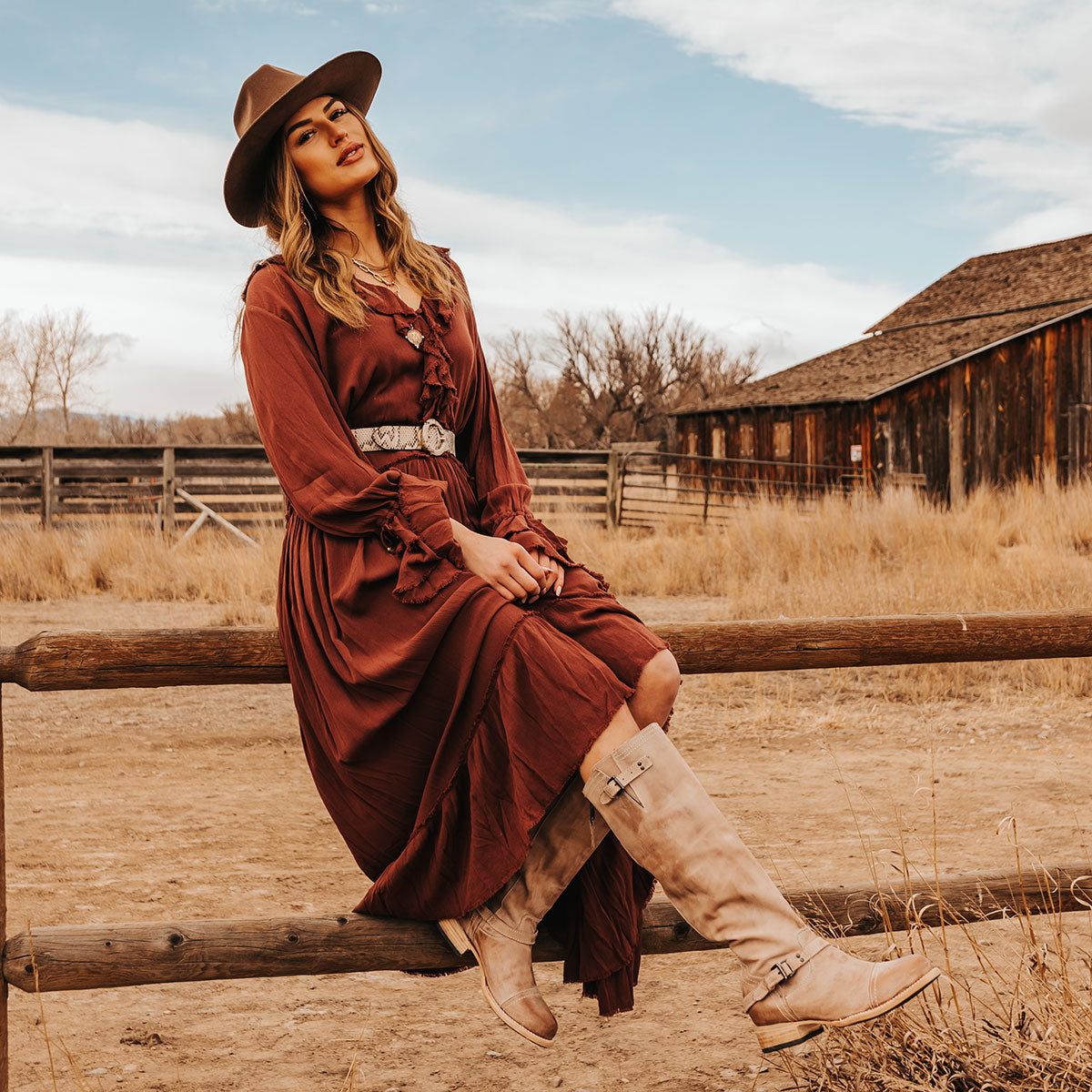 FREEBIRD women's Roadey taupe tall construction boot with double buckle detailing and signature red tracked zipper lifestyle image