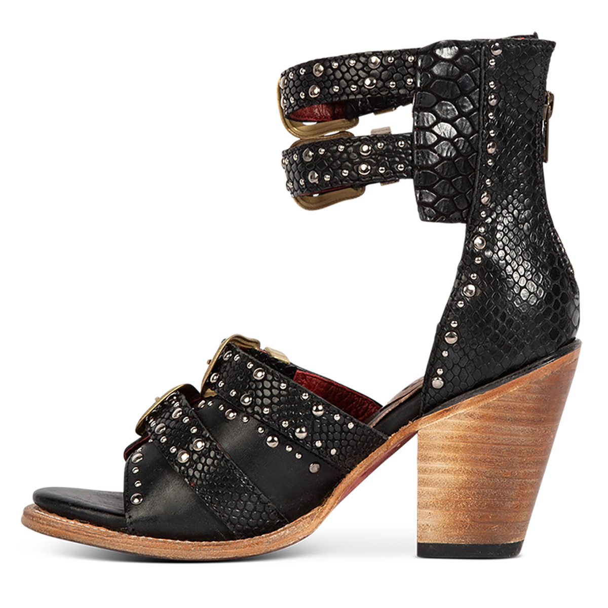 Inside view showing FREEBIRD women's Rodeo black multi leather sandal with silver stud embellishments, adjustable gold buckle detailing and a lifted inverted heel