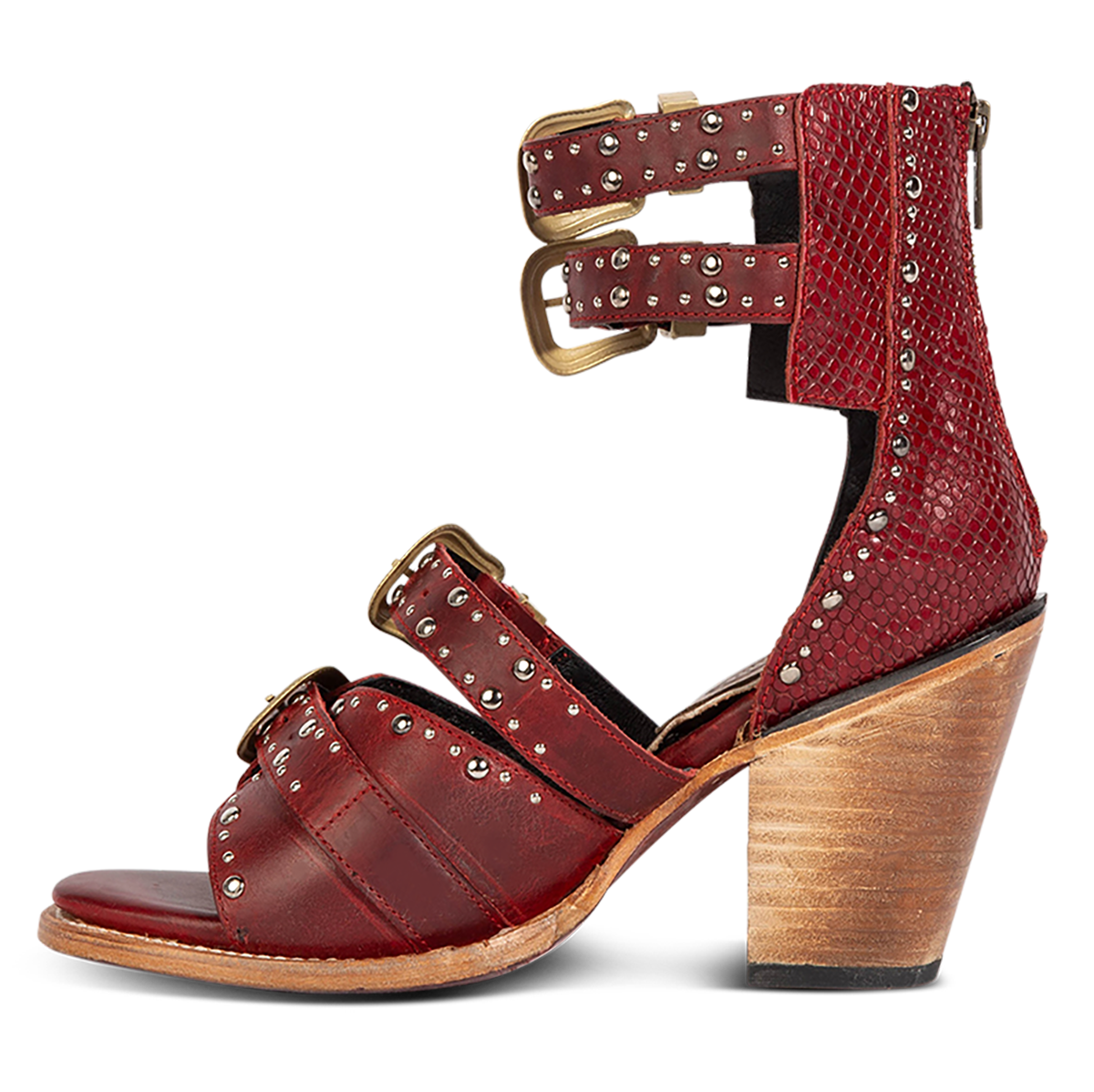 Inside view showing FREEBIRD women's Rodeo red multi leather sandal with silver stud embellishments, adjustable gold buckle detailing and a lifted inverted heel