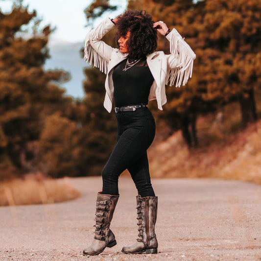 FREEBIRD women's Rory black leather boot with leather straps stacking up the front shaft and inside zip closure lifestyle
