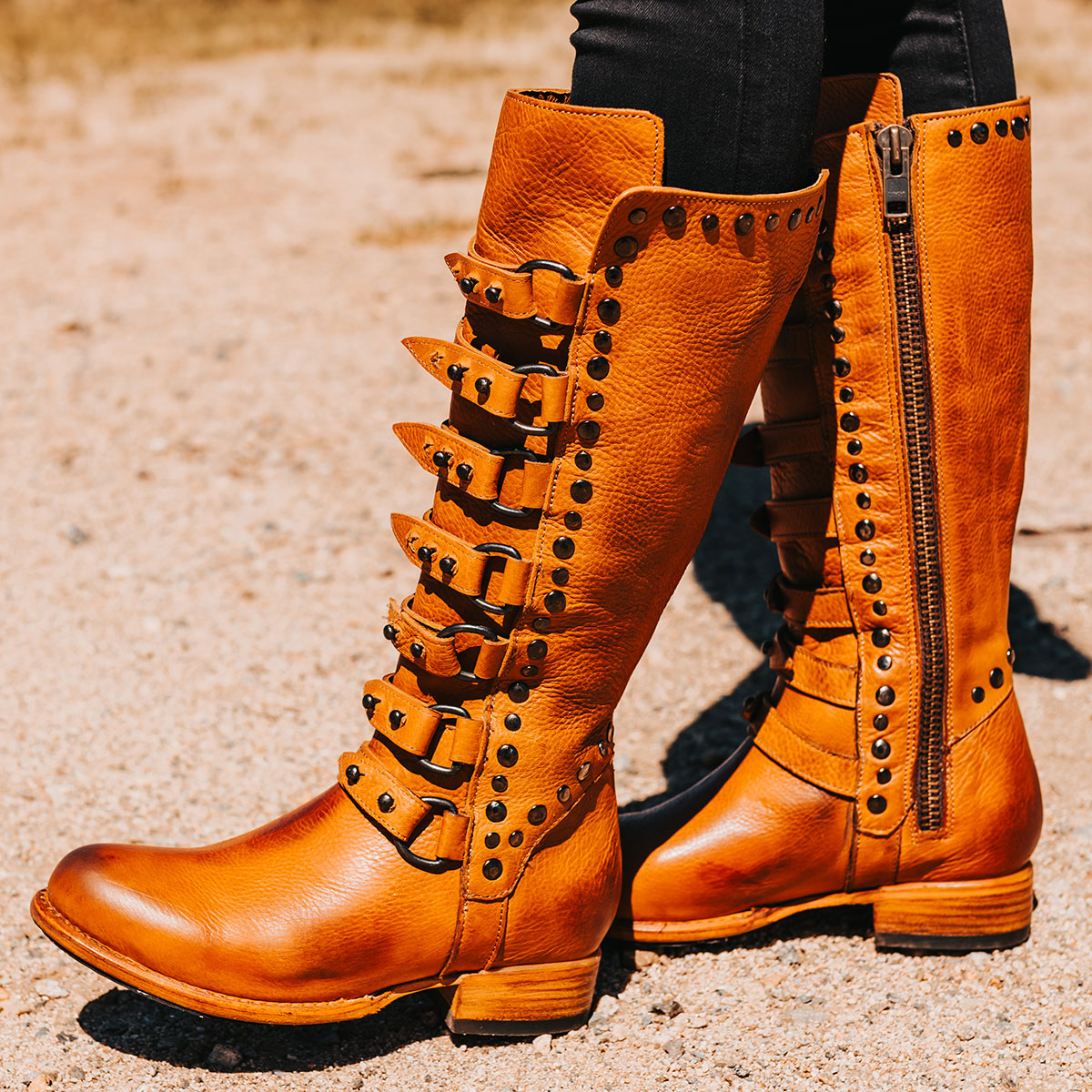 FREEBIRD women's Rory wheat leather boot with leather straps stacking up the front shaft and inside zip closure