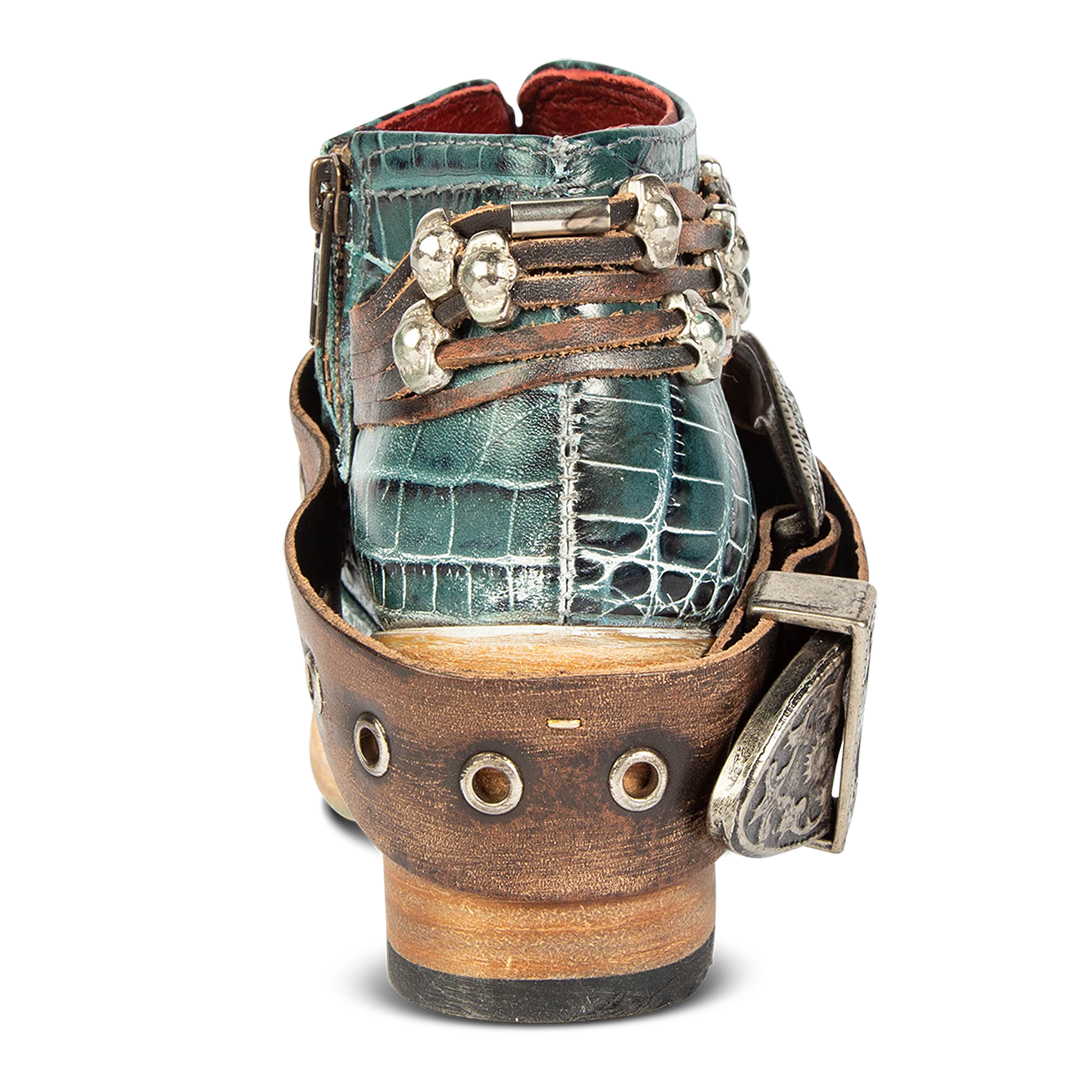 Back view showing low contrasting wood heel with western ankle belts on FREEBIRD women's Saloon turquoise croco bootie