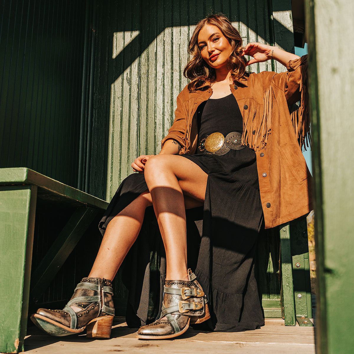 FREEBIRD women's Samantha pewter bootie with stud detailing, contrasting straps with gold hardware, and inside zip closure lifestyle image