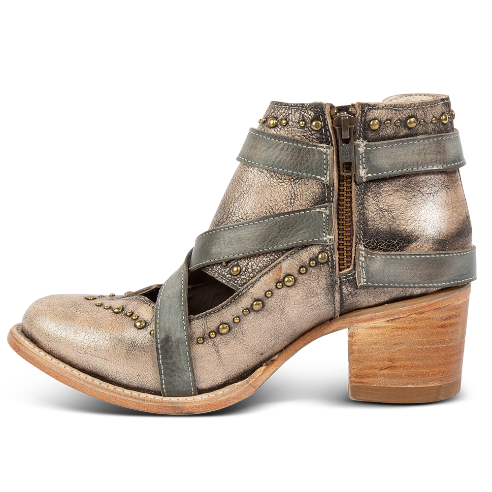 Side view showing low heel and working brass zip closure on FREEBIRD women's Samantha pewter bootie