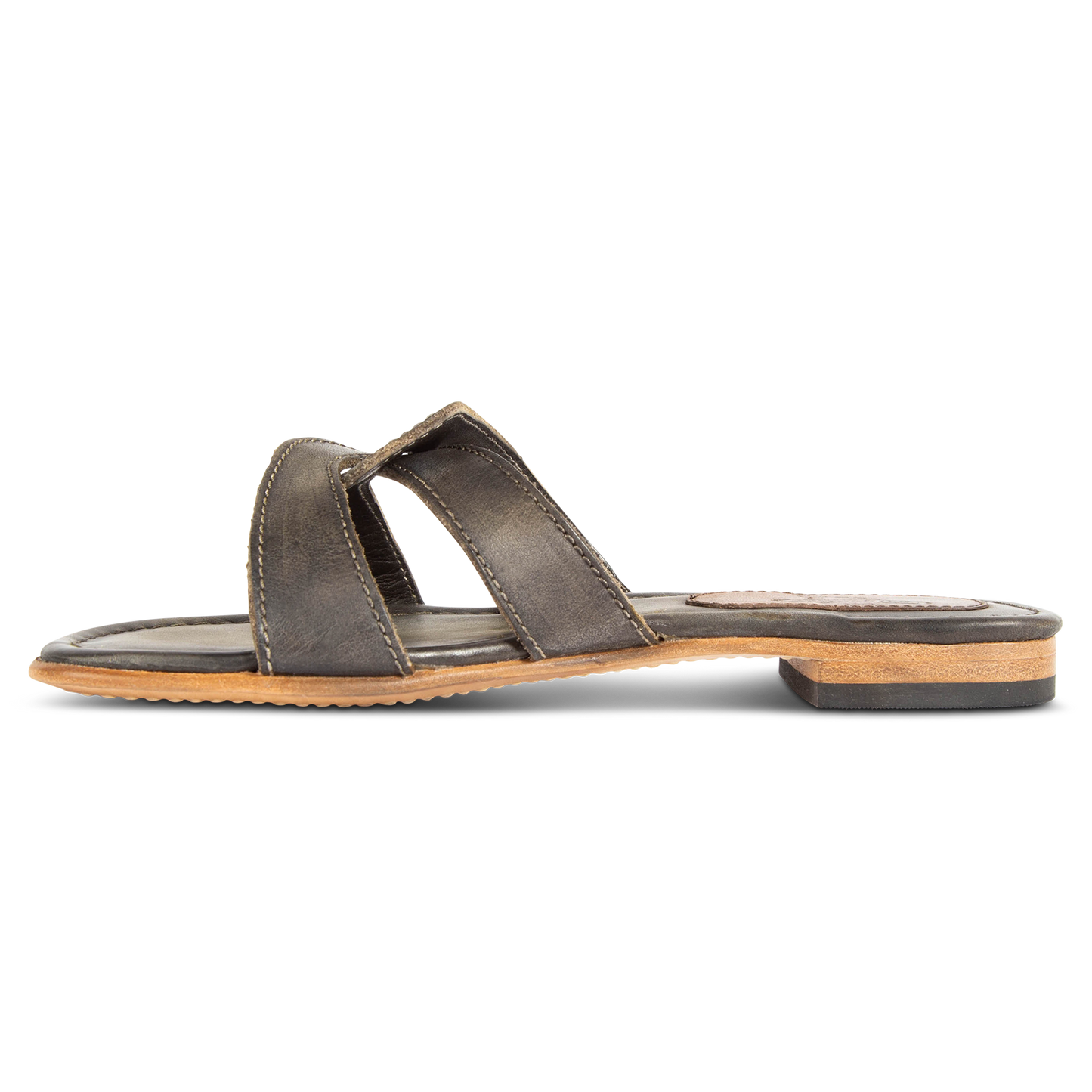 Inside view showing FREEBIRD criss-cross leather foot strap on women's Sawyer olive low heeled sandal