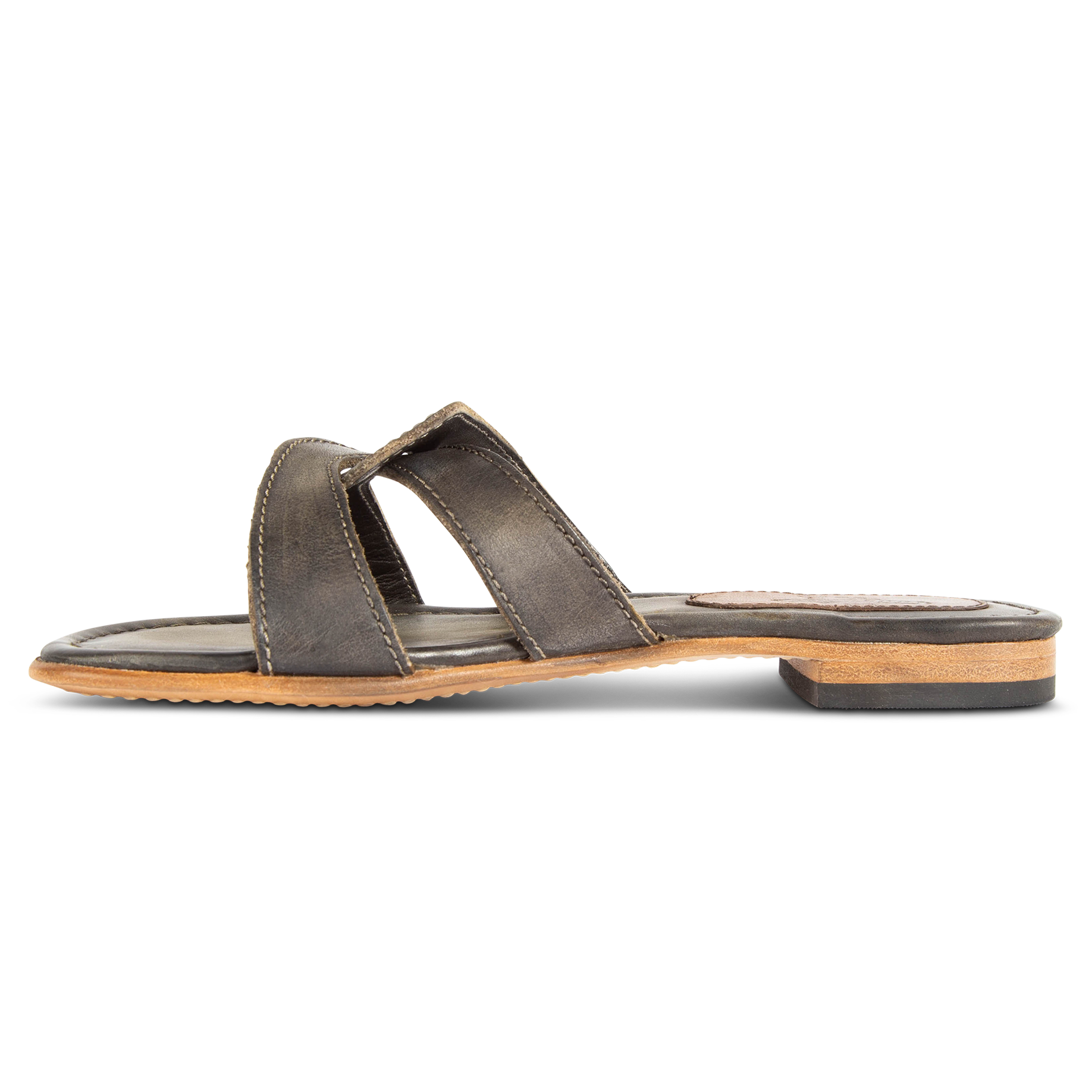 Inside view showing FREEBIRD criss-cross leather foot strap on women's Sawyer olive low heeled sandal