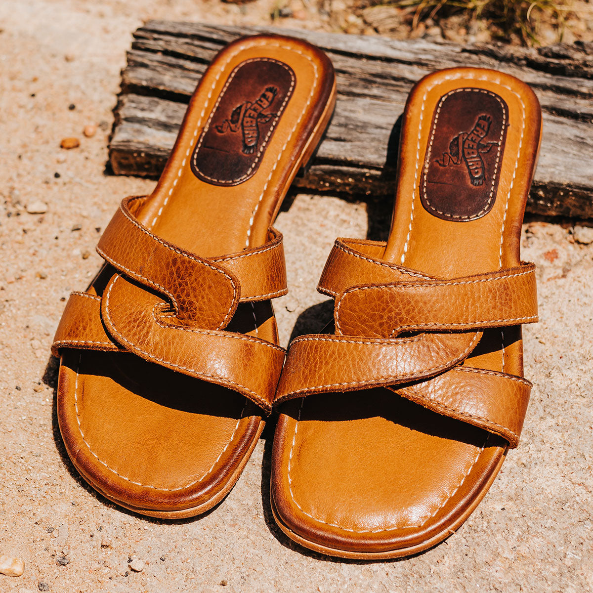 FREEBIRD women's Sawyer wheat low heeled slip on sandal featuring criss-cross leather foot straps