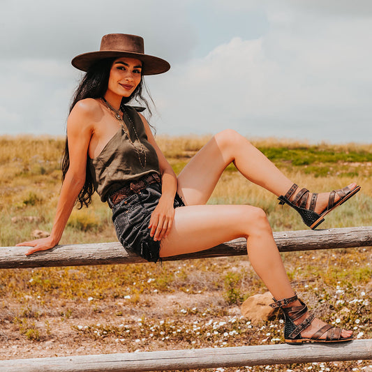 FREEBIRD women's Saylor Black Snake Multi strappy low heeled sandal featuring adjustable buckles and embossed detailing lifestyle