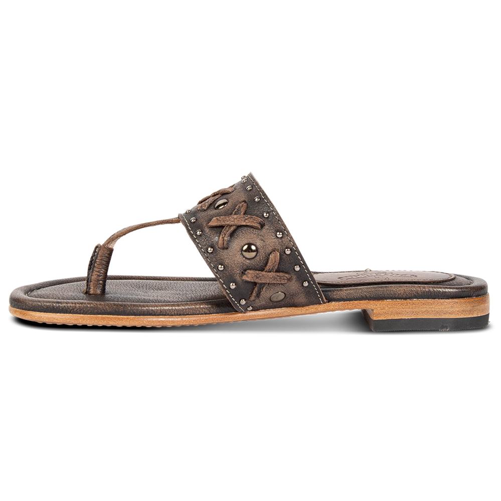 Inside view showing woven leather embellished foot strap FREEBIRD on women's Shay black low heeled sandal