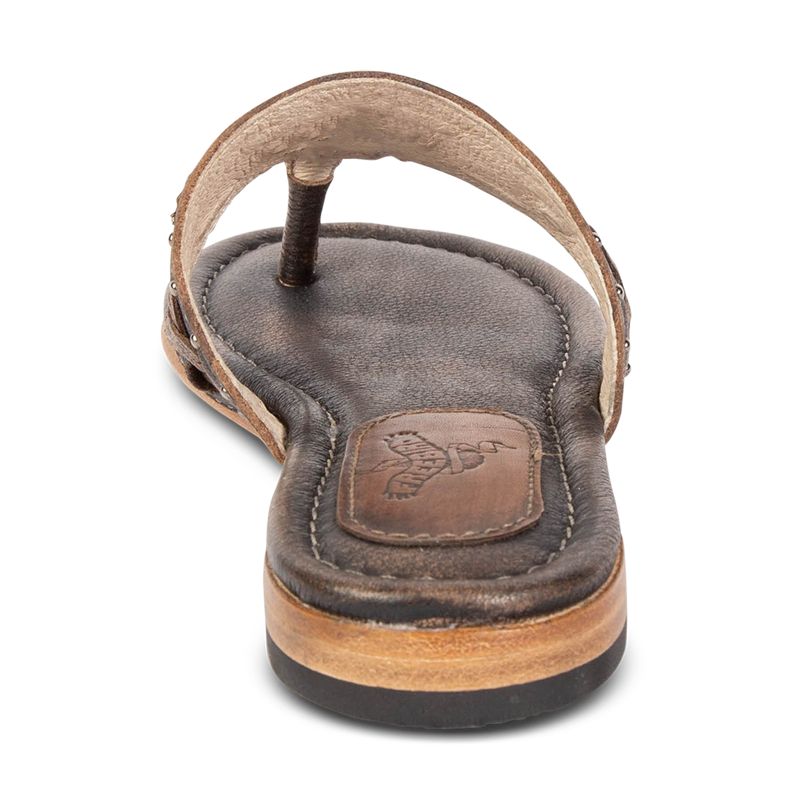 Back view showing low heel FREEBIRD on women's Shay black slip on sandal