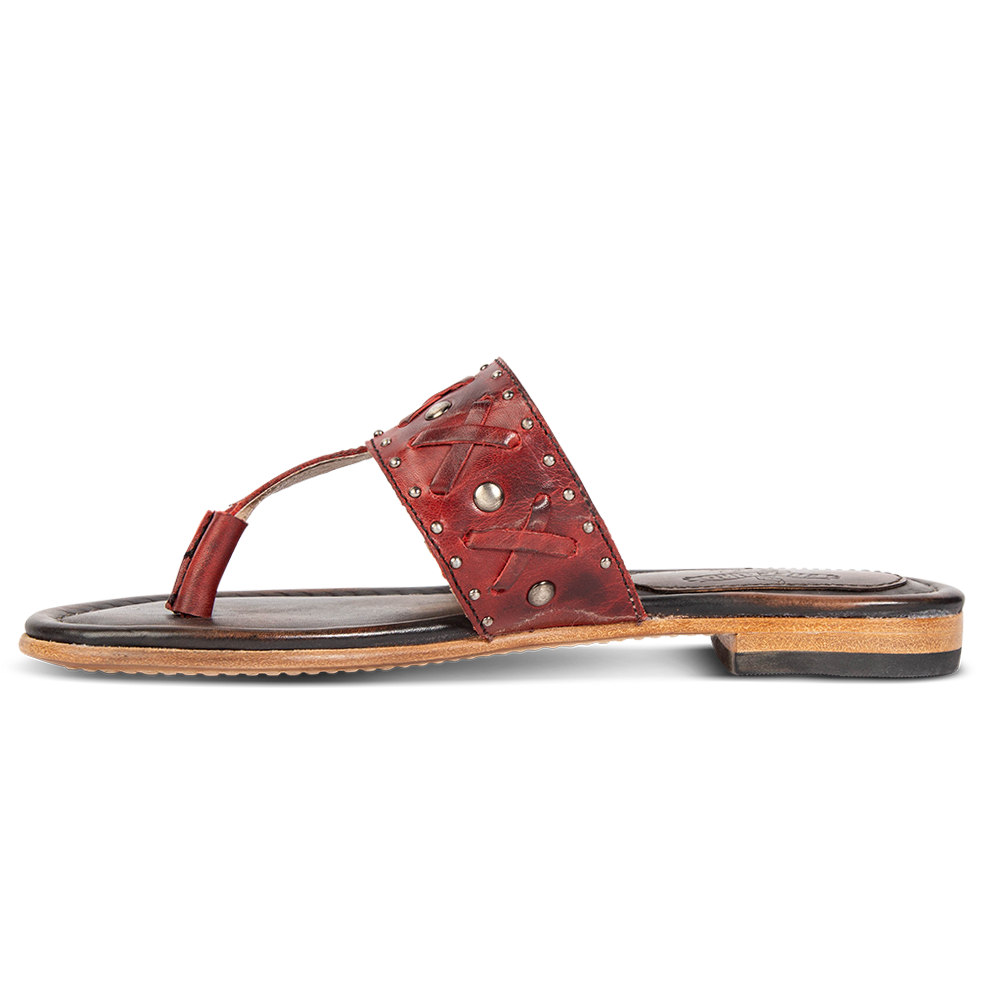 Inside view showing woven leather embellished foot strap FREEBIRD on women's Shay red low heeled sandal