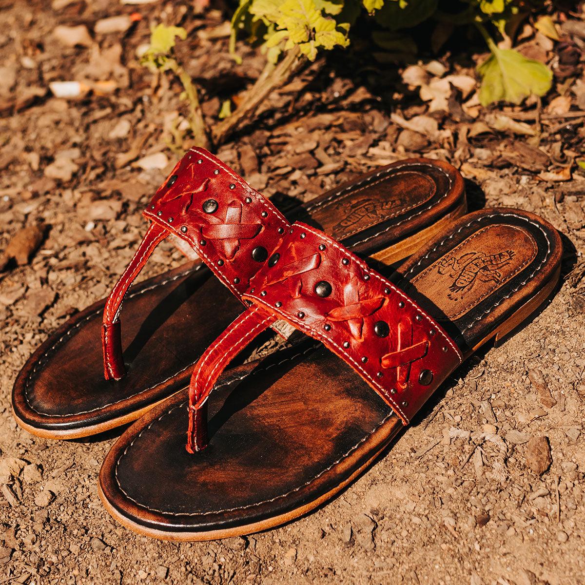 FREEBIRD women's Shay red low heeled slip on sandal featuring woven leather foot strap with stud embellishments