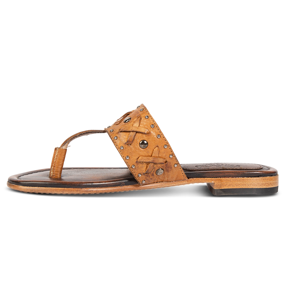Inside view showing woven leather embellished foot strap FREEBIRD on women's Shay wheat low heeled sandal