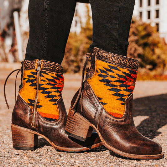FREEBIRD women's Songbird brown leather bootie with woven detailing, leather tie lacing and an inside working brass zip closure