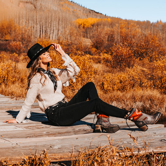 FREEBIRD women's Songbird stone leather bootie with woven detailing, leather tie lacing and an inside working brass zip closure lifestyle 