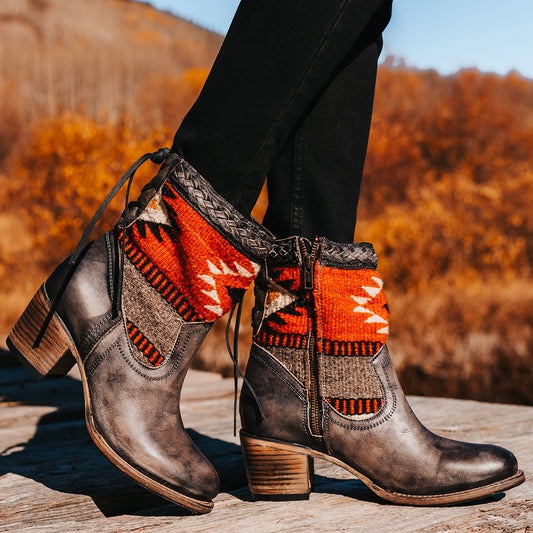 FREEBIRD women's Songbird stone leather bootie with woven detailing, leather tie lacing and an inside working brass zip closure