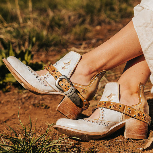 FREEBIRD women's Stardom beige bootie with silver stud detailing, laser cut leather, open ankles, and a decorative ankle strap