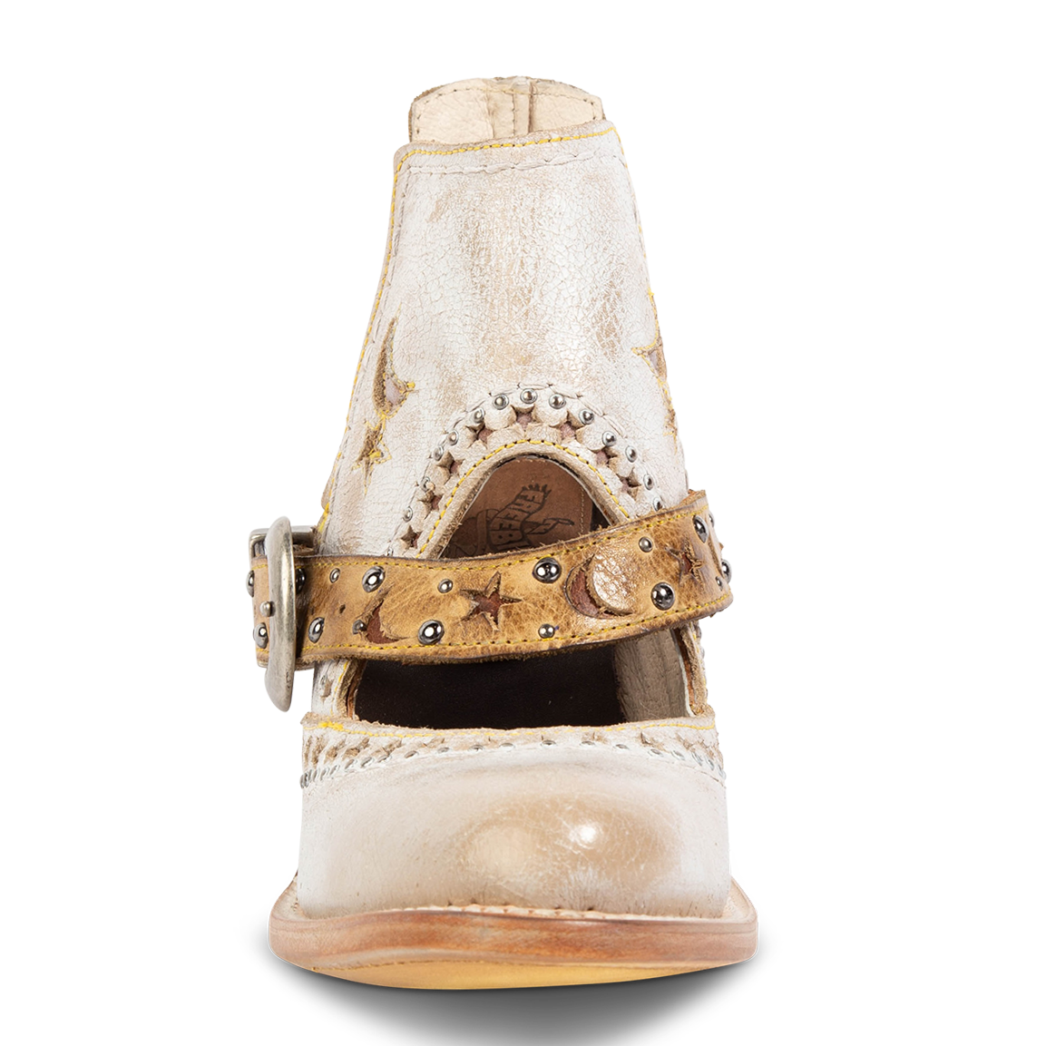 Front view showing laser cut leather detailing, instep cutout, and ankle strap with stars/moons on FREEBIRD women's Stardom beige bootie