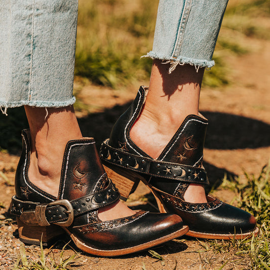 FREEBIRD women's Stardom black bootie with silver stud detailing, laser cut leather, open ankles, and a decorative ankle strap