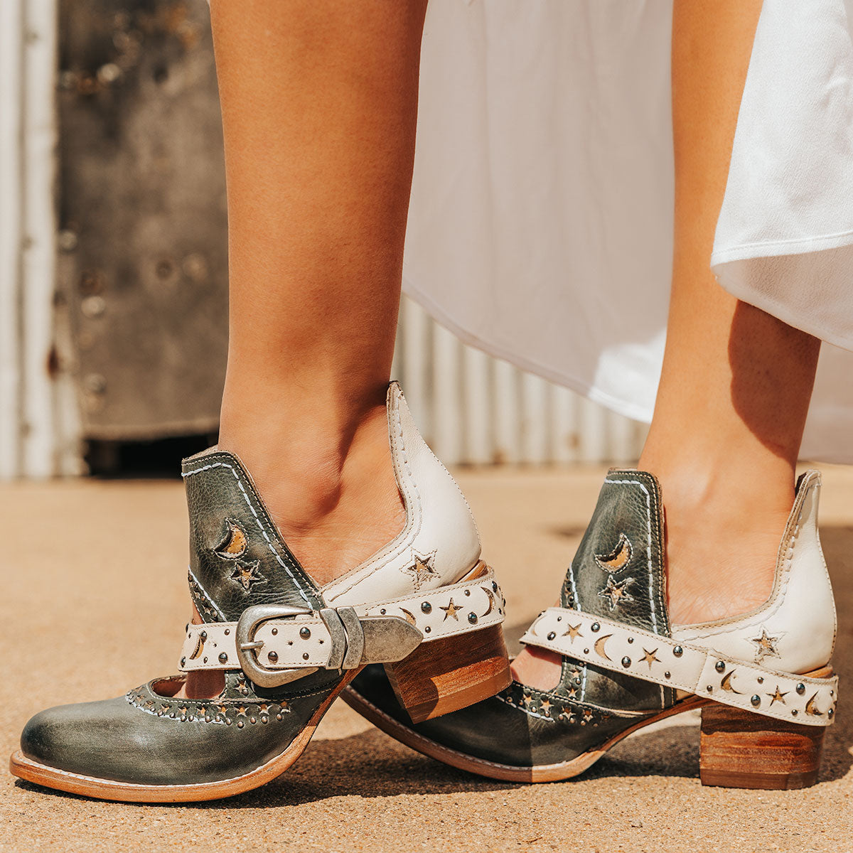 FREEBIRD women's Stardom blue bootie with silver stud detailing, laser cut leather, open ankles, and a decorative ankle strap