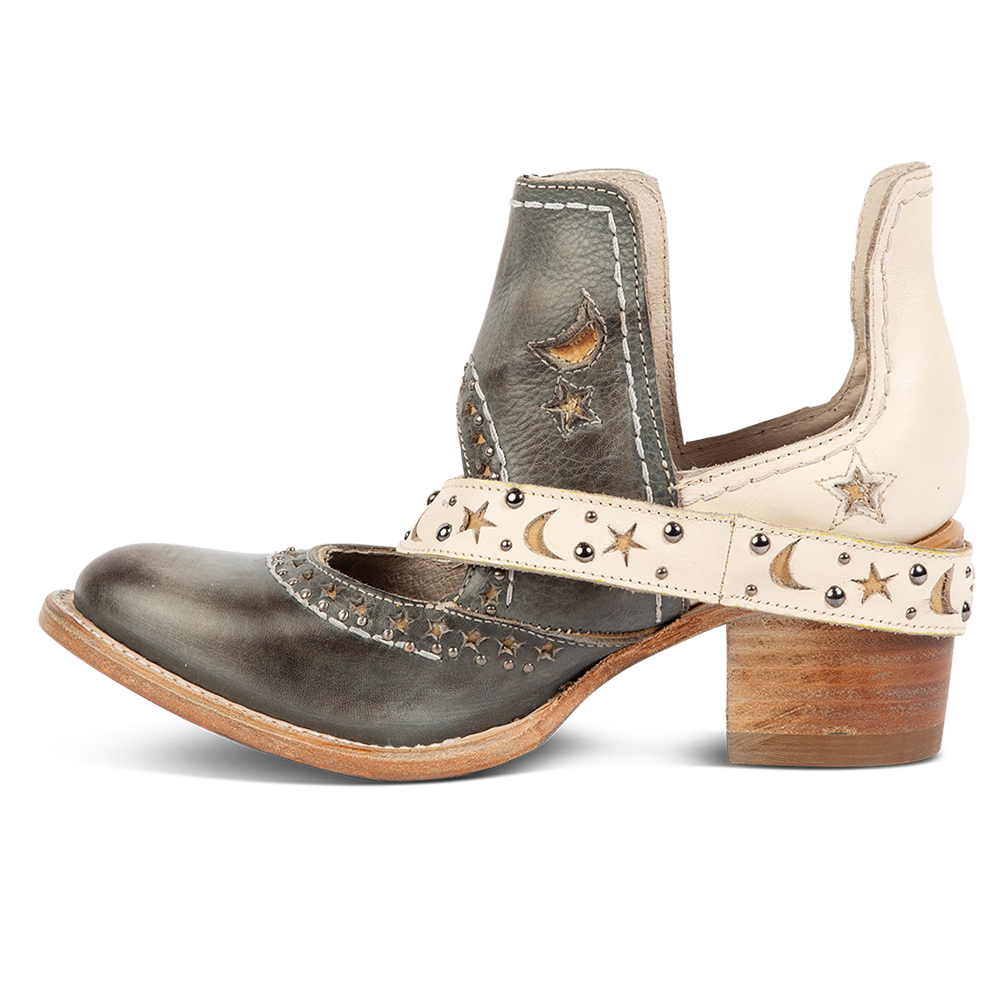 Side view showing a decorative ankle strap, silver stud detailing, and exposed ankles on FREEBIRD women's Stardom wine bootie