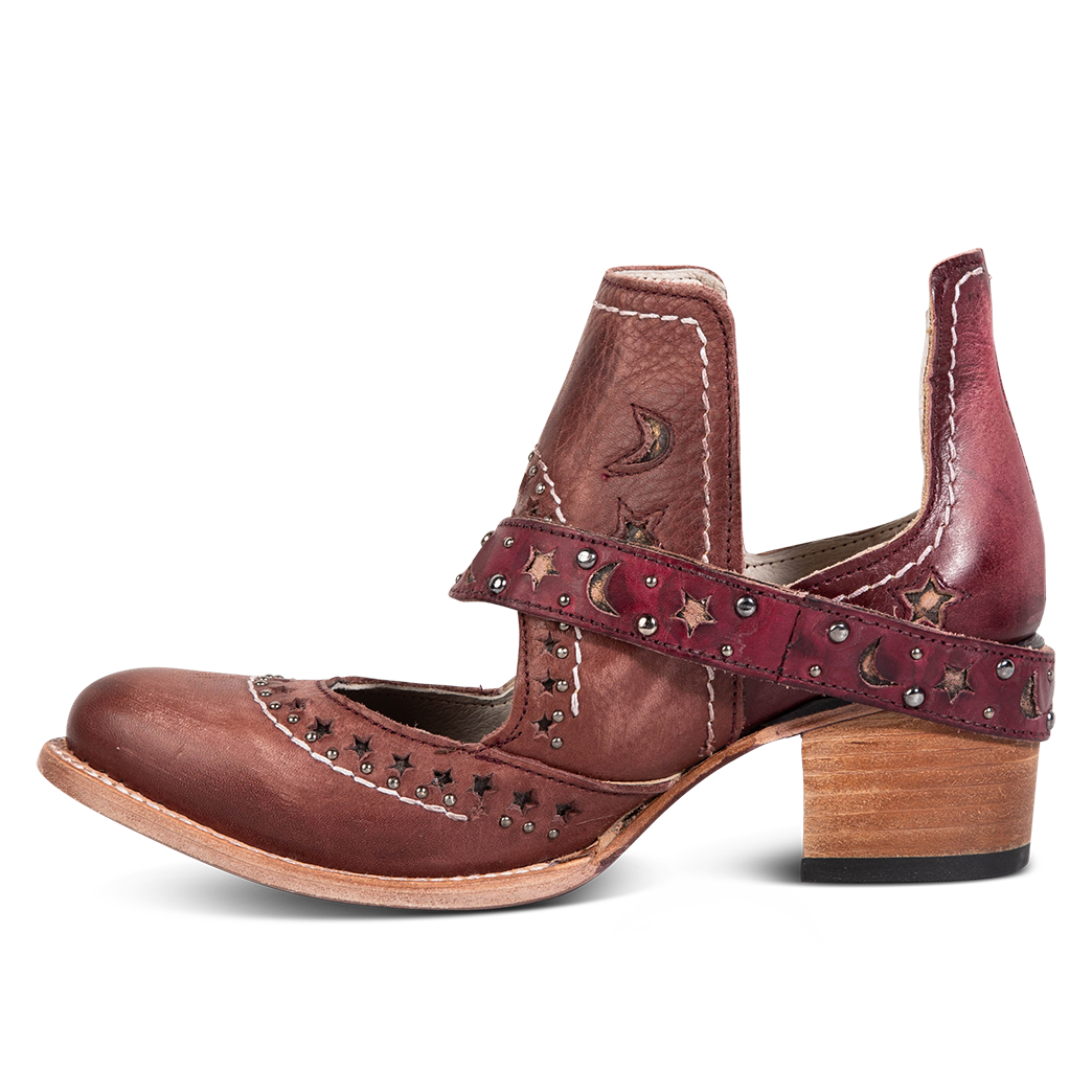Side view showing a decorative ankle strap, silver stud detailing, and exposed ankles on FREEBIRD women's Stardom wine bootie