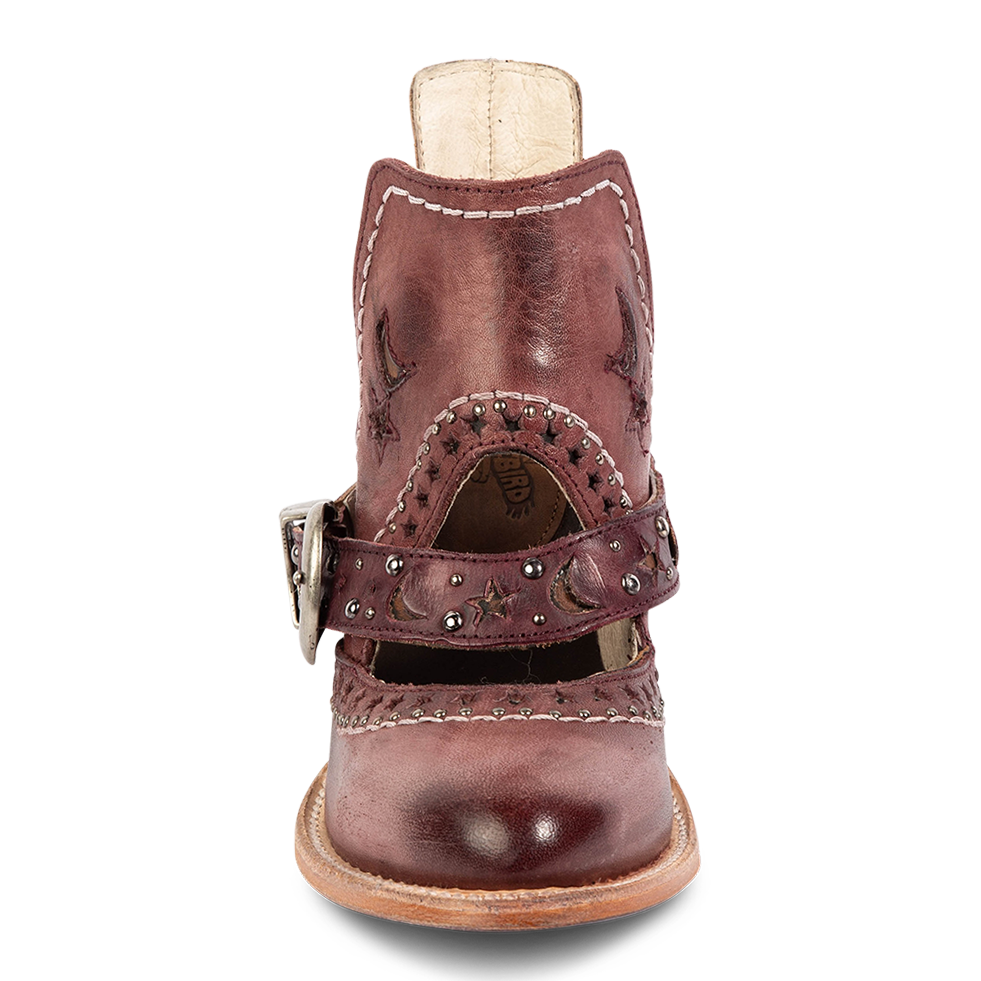 Front view showing laser cut leather detailing, instep cutout, and ankle strap with stars/moons on FREEBIRD women's Stardom wine bootie
