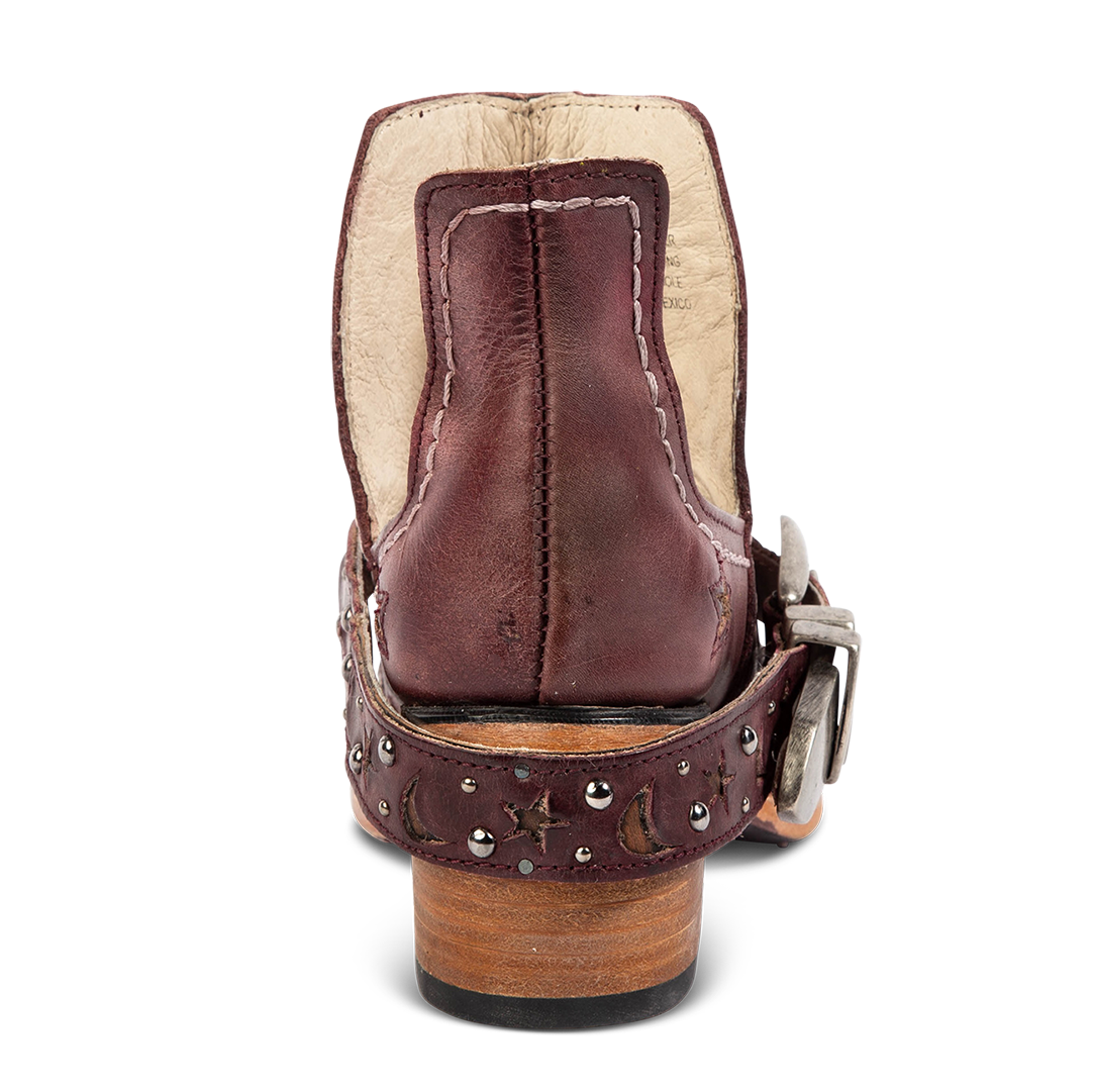 Back view showing a low stacked heel and decorative ankle strap on FREEBIRD women's Stardom wine bootie
