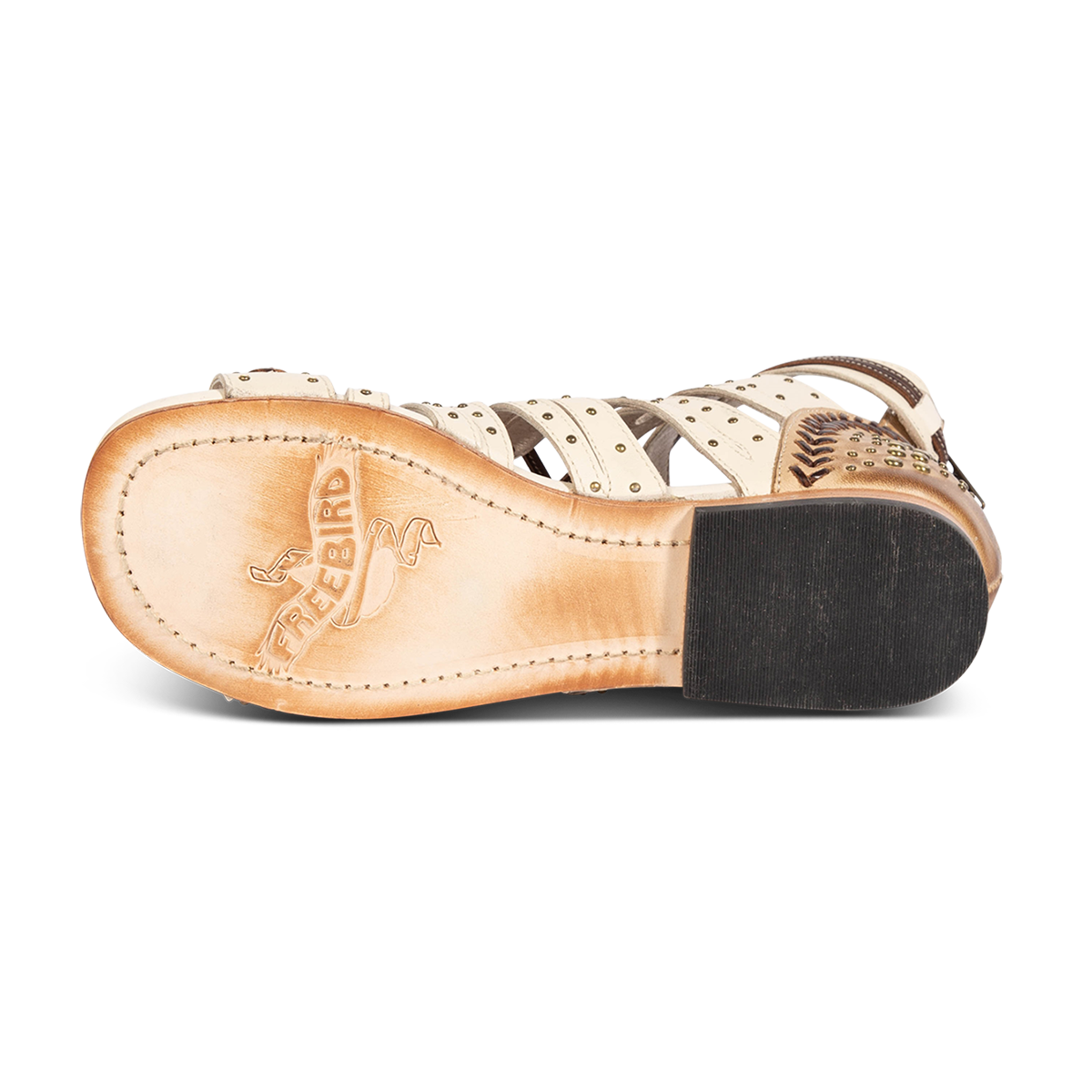 Leather sole imprinted with FREEBIRD on women's Swan beige leather sandal