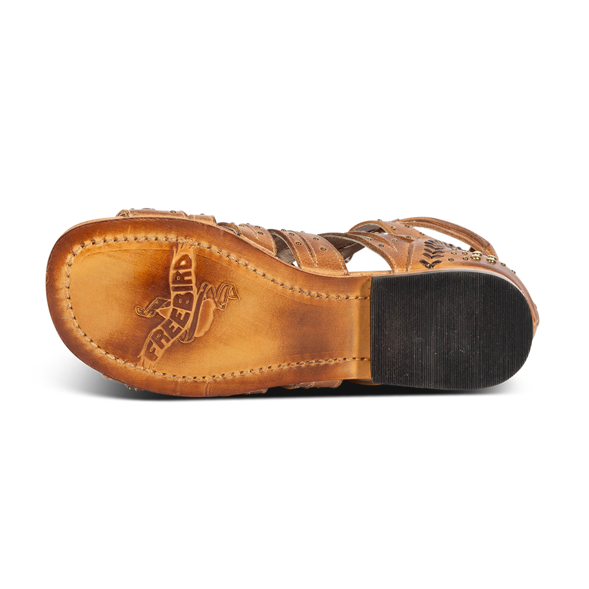 Leather sole imprinted with FREEBIRD on women's Swan wheat leather sandal