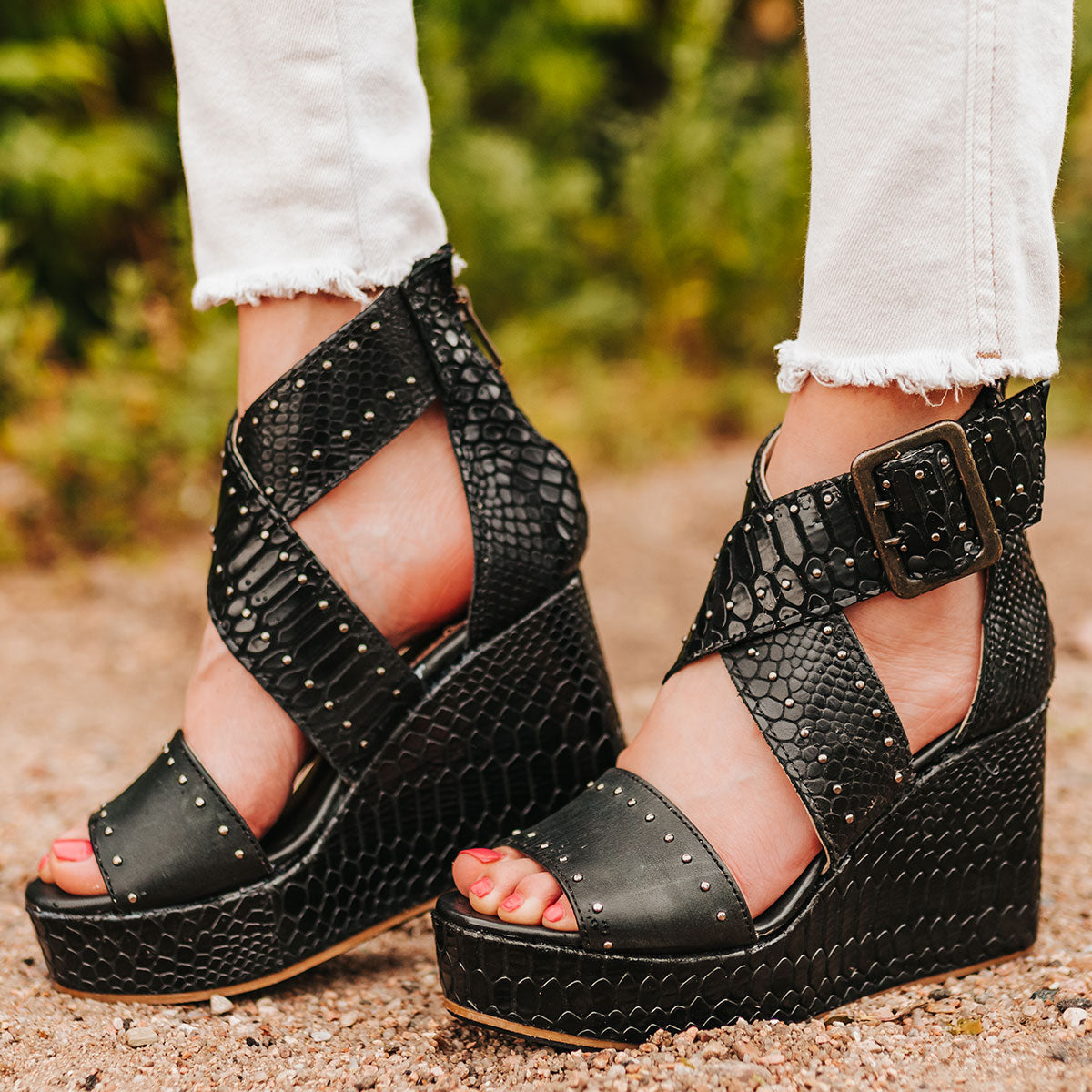 FREEBIRD women's Terra black snake platform sandal with wedge heel, an adjustable ankle strap, and stud detailing
