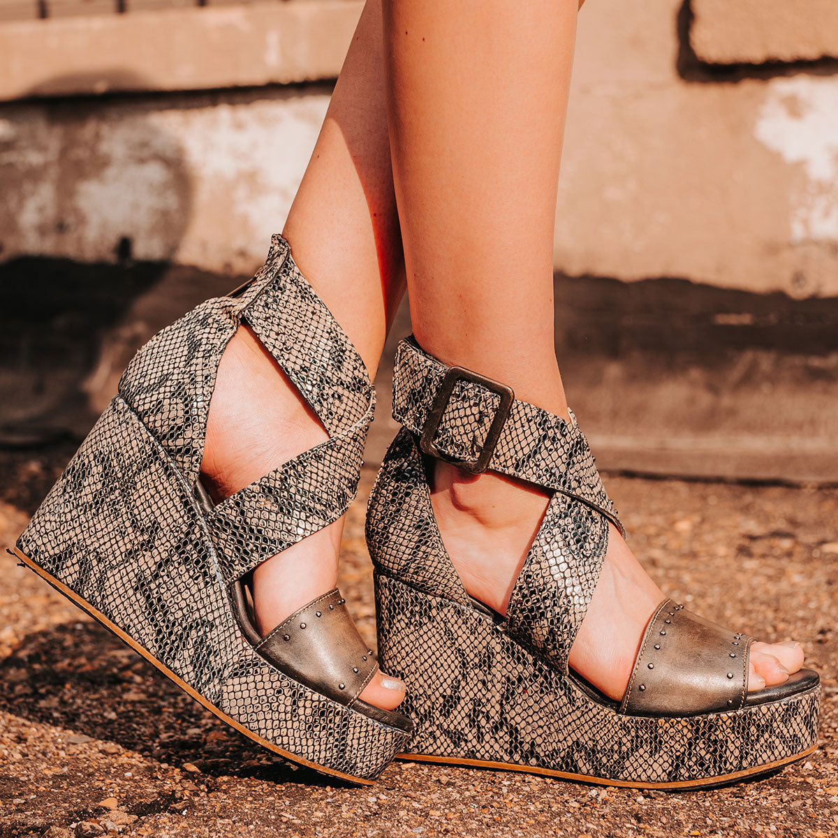 FREEBIRD women's Terra olive snake multi platform sandal with wedge heel, an adjustable ankle strap, and stud detailing