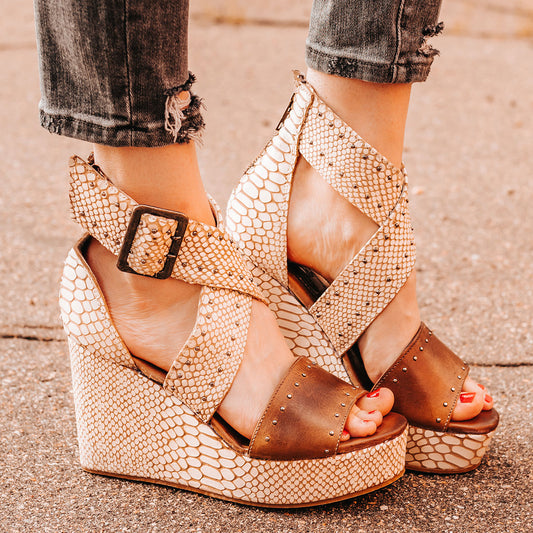 FREEBIRD women's Terra white snake multi platform sandal with wedge heel, an adjustable ankle strap, and stud detailing