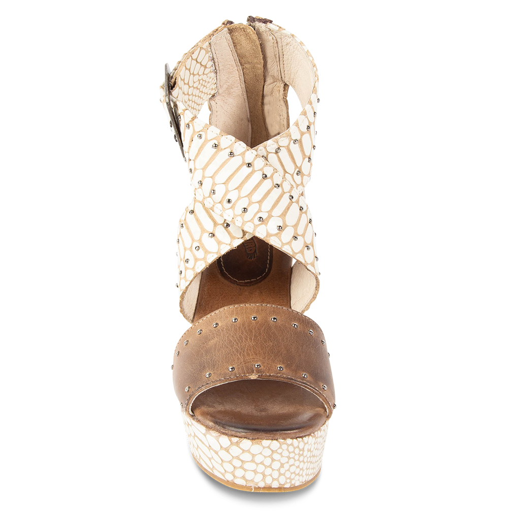 Front view showing cross-over ankle straps on FREEBIRD women's Terra white snake multi platform sandal with wedge heel and stud detailing