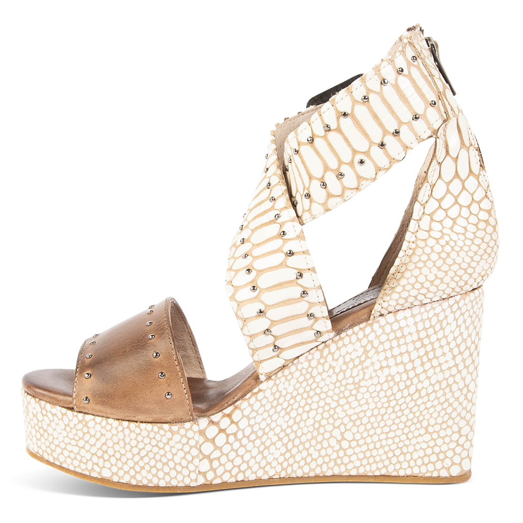 Inside view showing wedge heel and ankle straps on FREEBIRD women's Terra white snake multi platform sandal with stud detailing