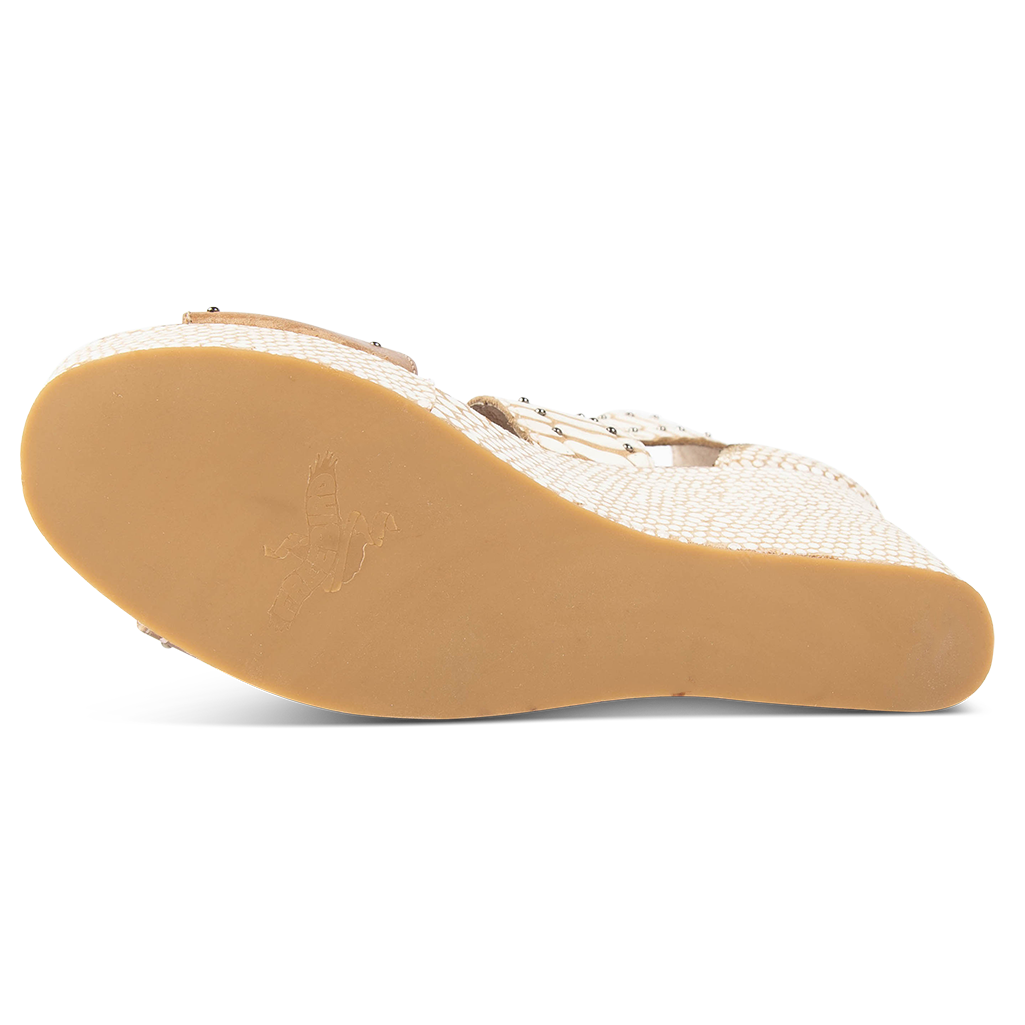 Rubber sole imprinted with FREEBIRD on women's Terra white snake multi platform sandal with stud detailing