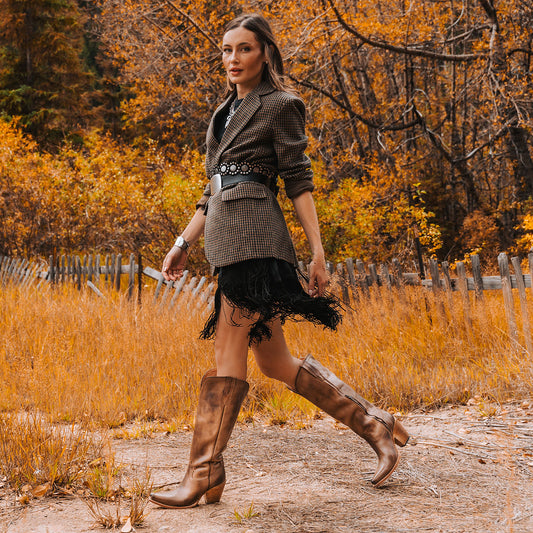 THUNDERBIRD beige leather tall heeled boots featuring a zip-up design and a sleek western silhouette lifestyle
