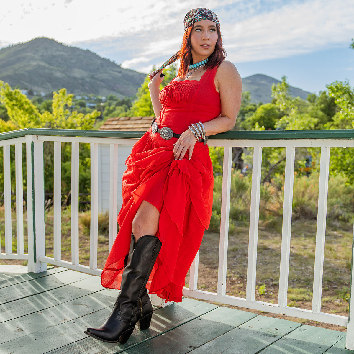 Thunderbird black premium tall leather boots styled with a red dress